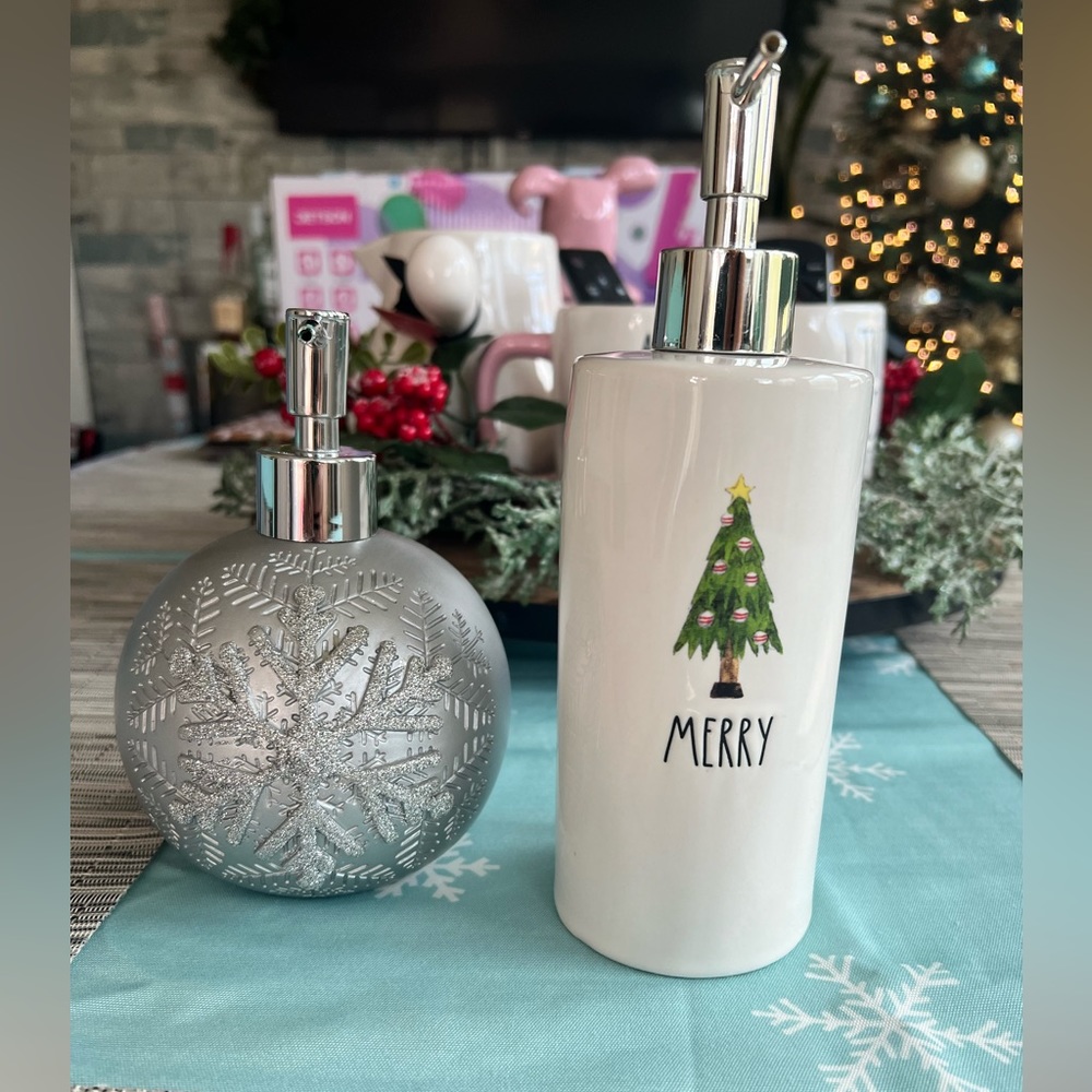 Two Christmas hand soap dispensers
